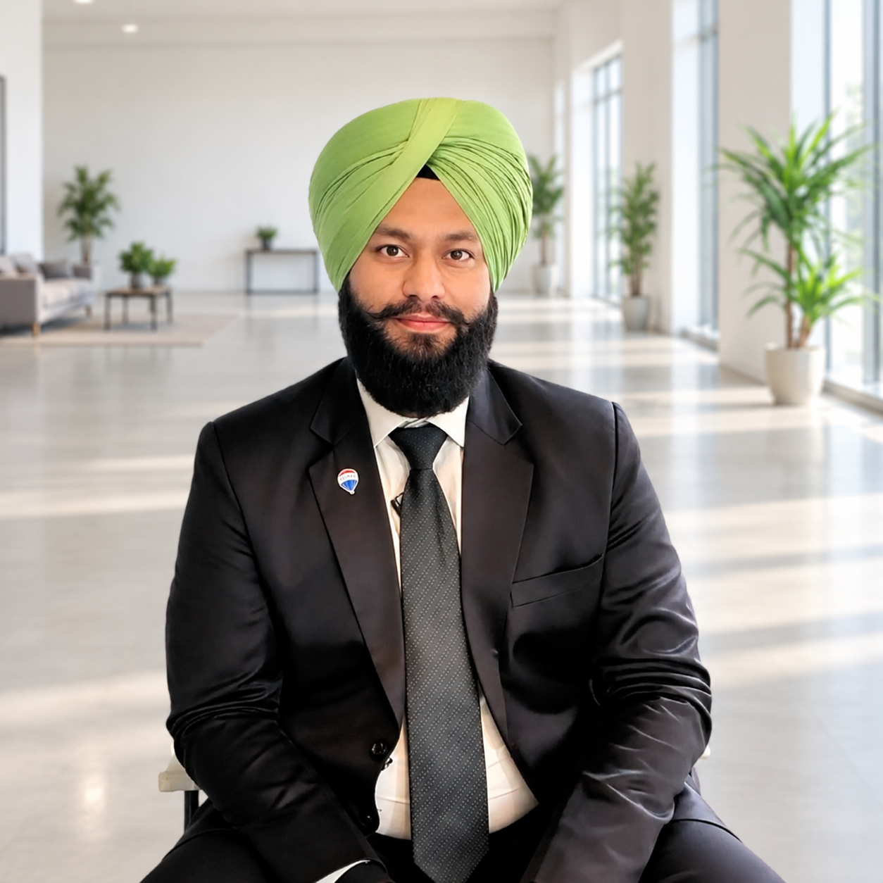 Preetinder Singh, Your Realtor Preet, wearing a dark suit and green turban